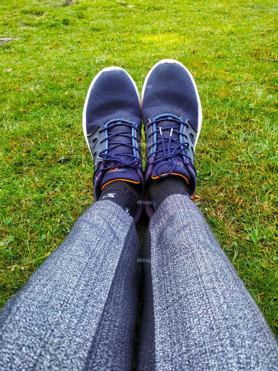 Feet in shoes in the meadow