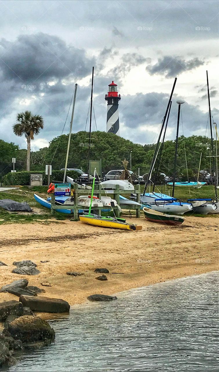Boats along Salt Run in the shadow of Saint Augustine lighthouse