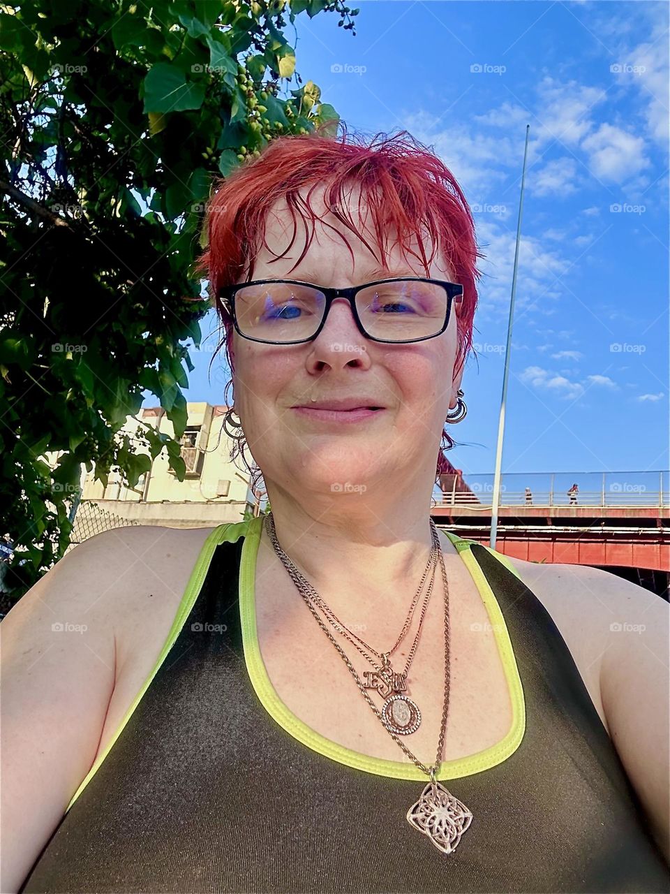 This is me, “Petra Schiller” a.k.a. “Maxine Firefox” standing outside aboard “Salvation”, a “28 ft 1969 Luhrs” cabin cruiser at “Newtown Creek” by the “Pulaski Bridge” in LIC, home to myself and partner “Timothy Trespas”. 2024. Hypnotic Productions