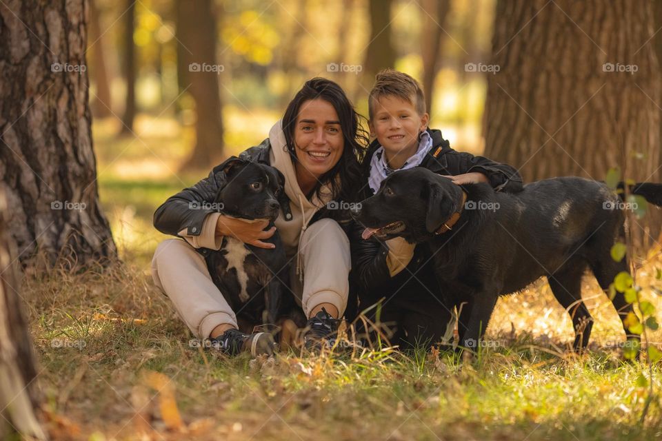 walking the dog, people walking the dogs on the street, they spend time together, the person plays with the dog, trains it, eat delicious food, take pictures. best friends are dogs. children and dogs for a walk