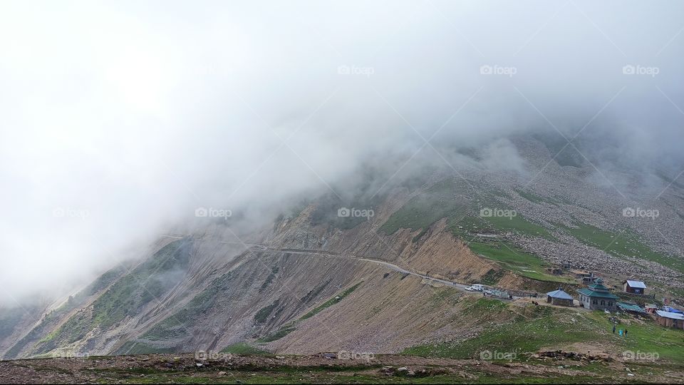A beautiful picture of Mughal road near Historic Peer ki Galli Mosque at start of Zigs -on Shopian Side in mid Summer ;having Clouds very close as usual.....