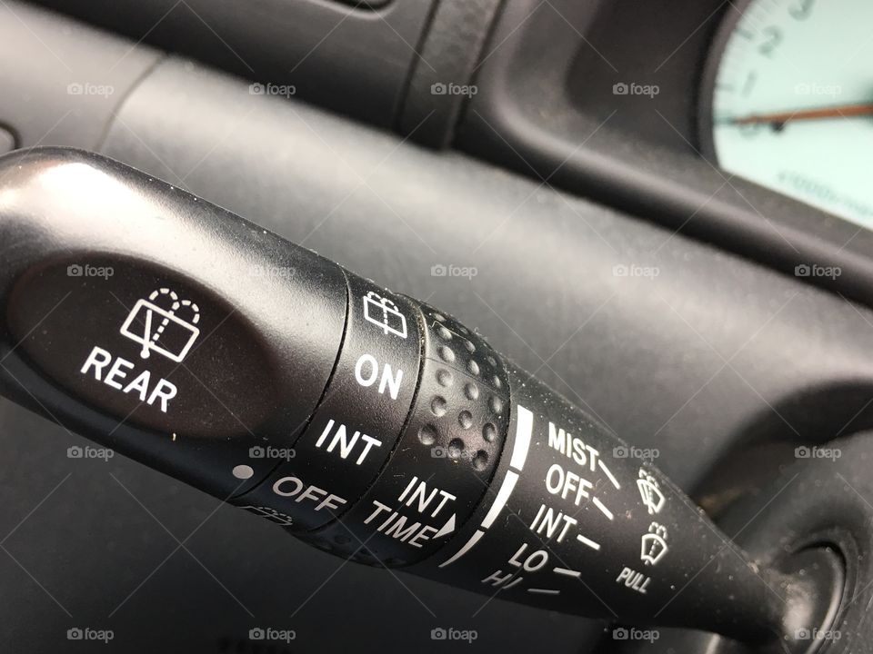 Black and white image car interior, winds hiked wiper control stick