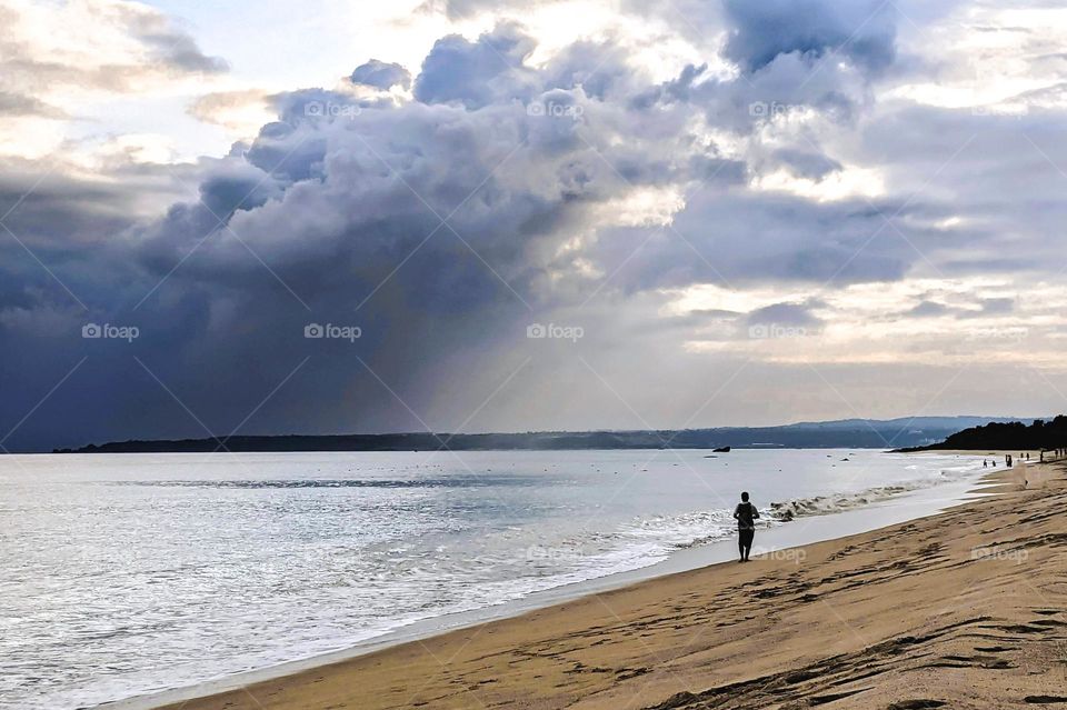 Thick clouds by the beach