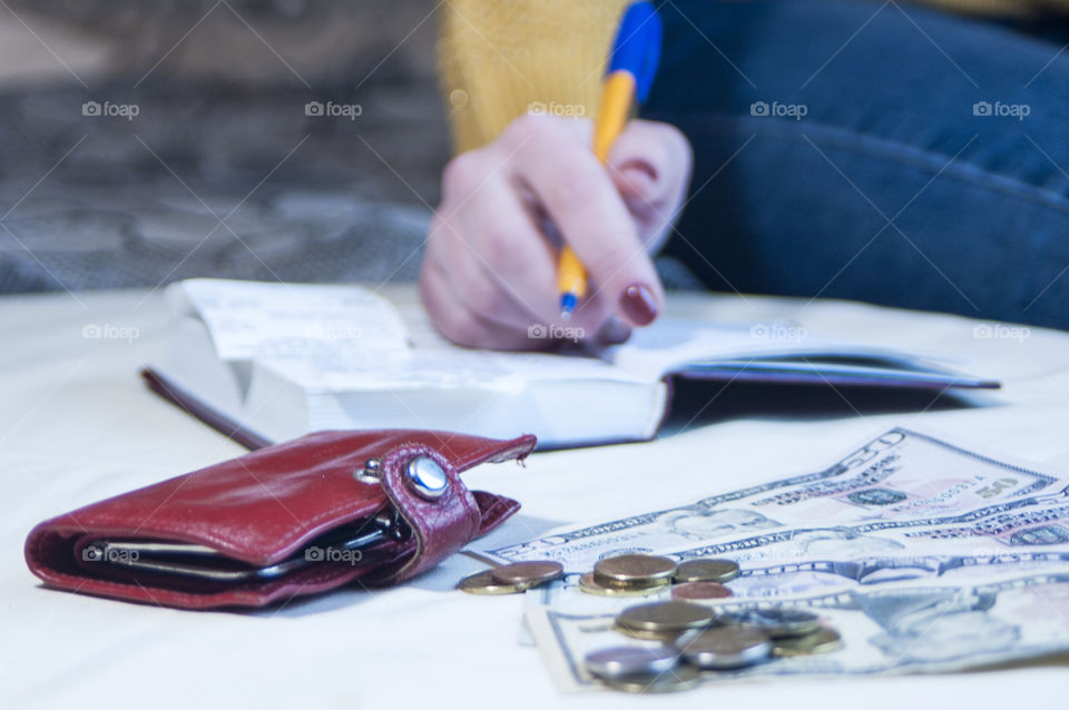 woman takes notes in notepad and says Finance