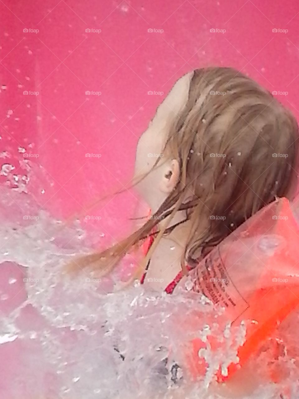 splash. sliding down the pool slide