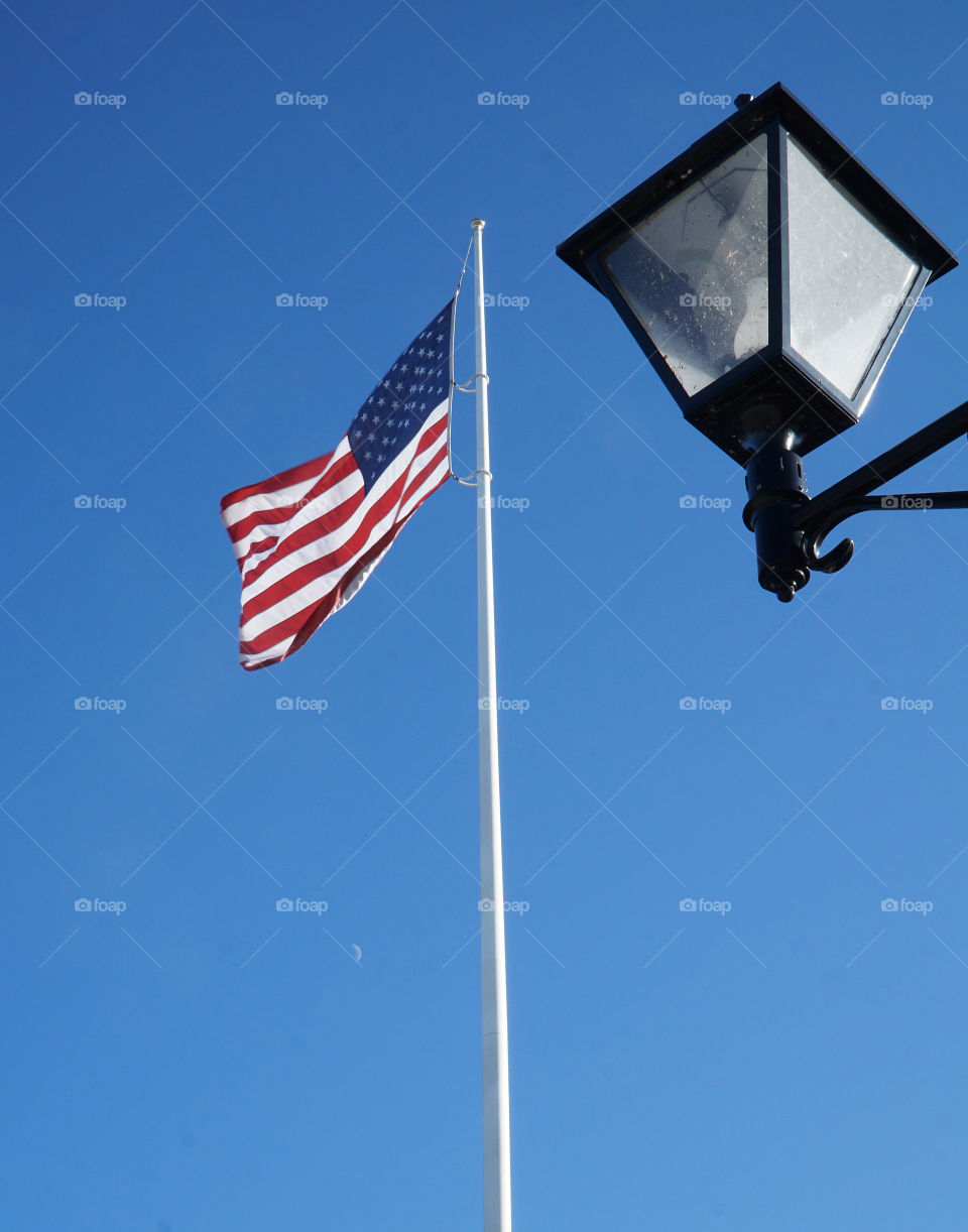 Flag with moon during the day
