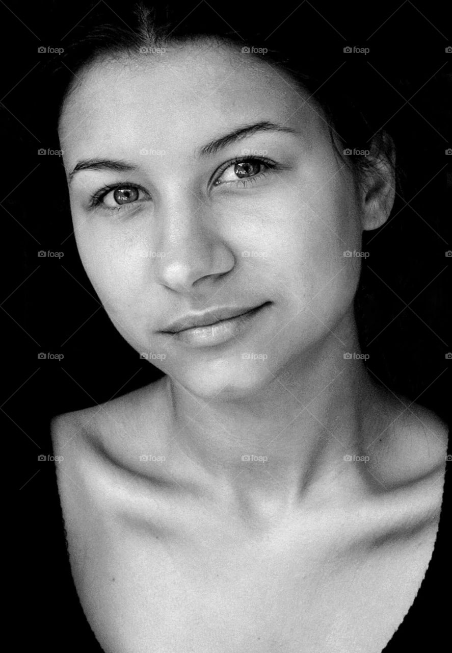 Black and white portrait of smiling young woman