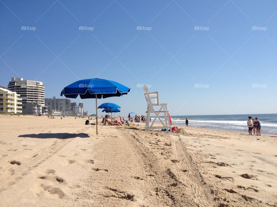 Umbrellas and lifeguard chair on a beach in Clearwater, Florida