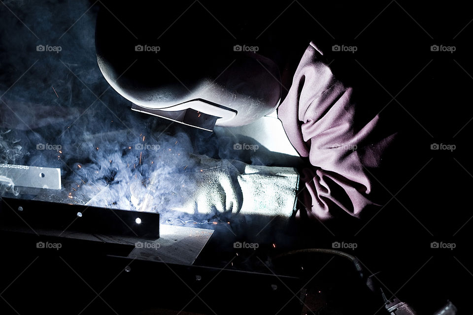 Welder worker closeup un mask