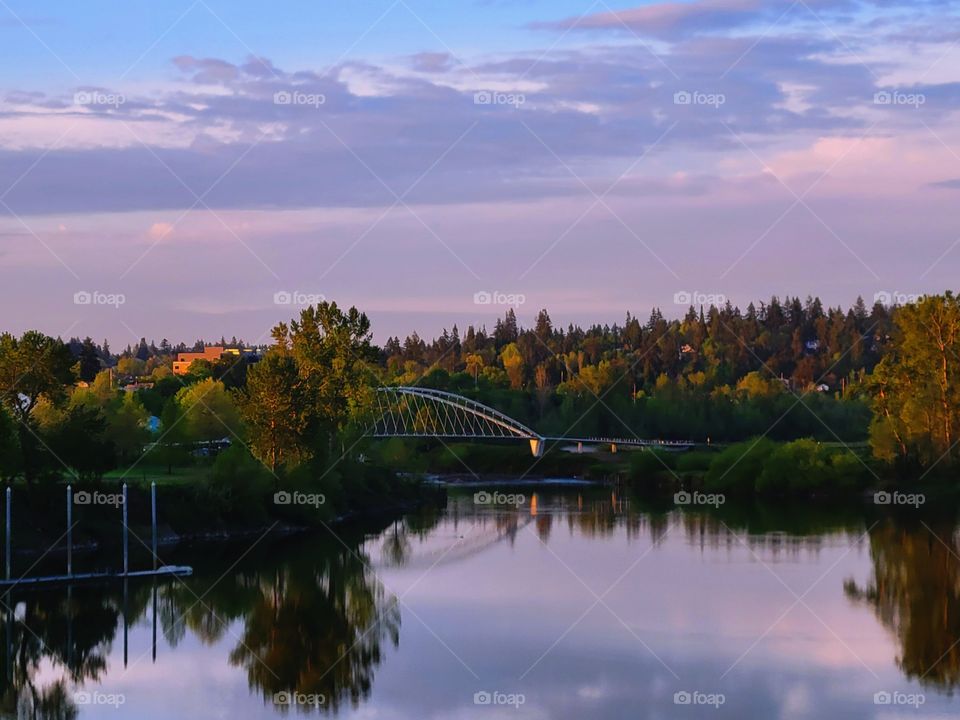 Pink sunrise cloudscape over the Willamette River in West Salem Oregon