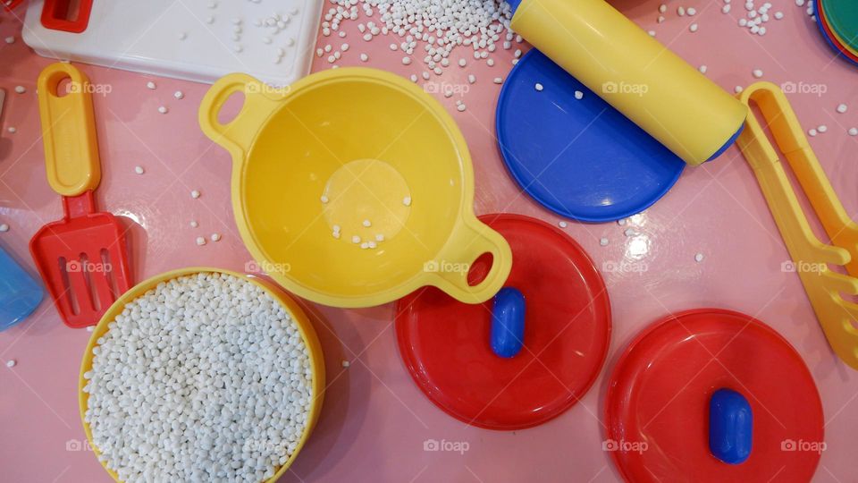 Plastic toy cooking utensils for children to play.