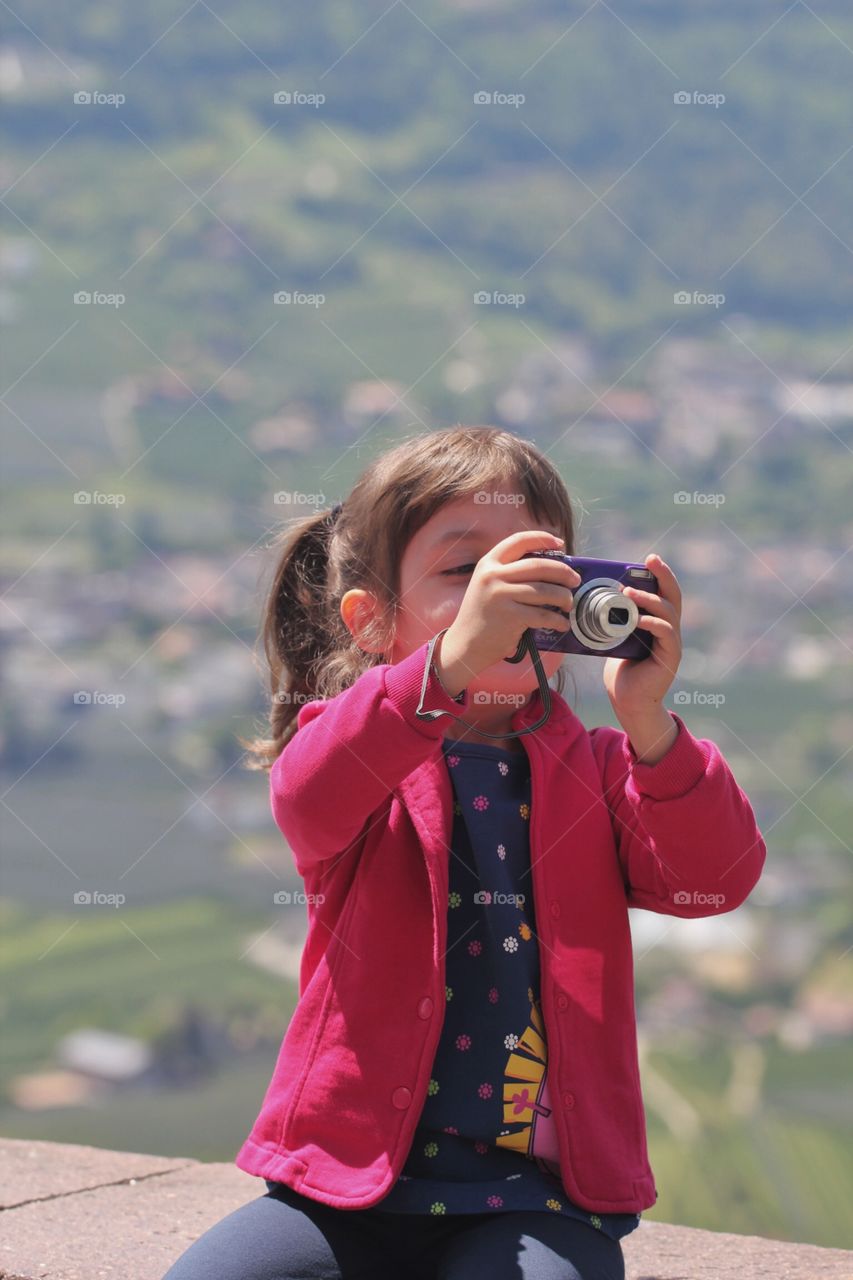 Little girl is taking picture 