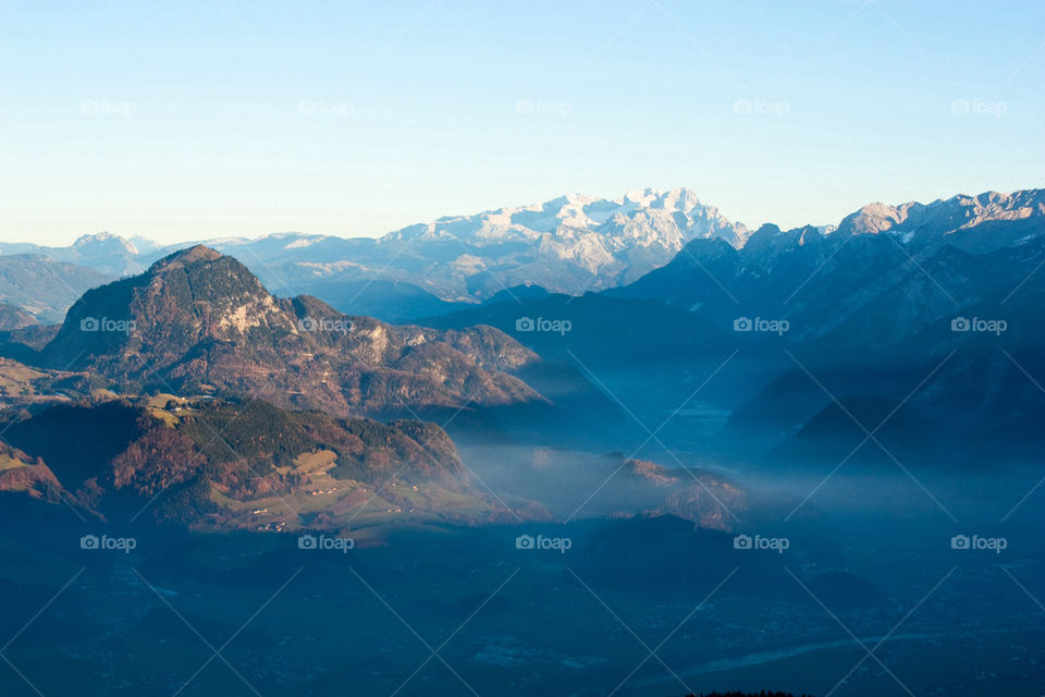 Scenic view of valley in foggy weather