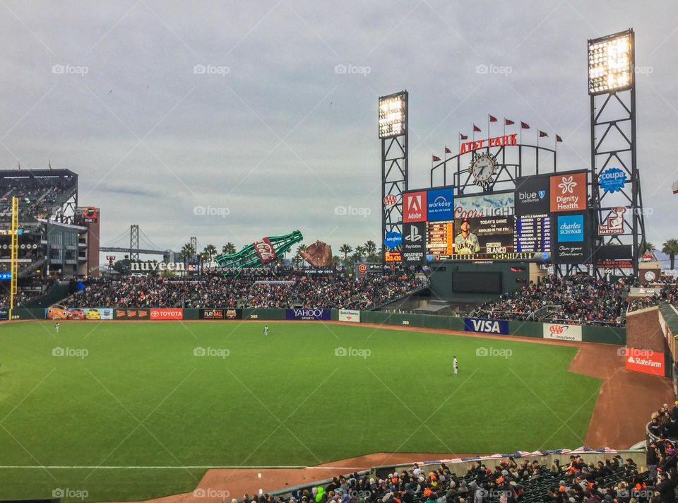 Beautiful evening for a baseball game in San Francisco California with fans rooting for their team to win