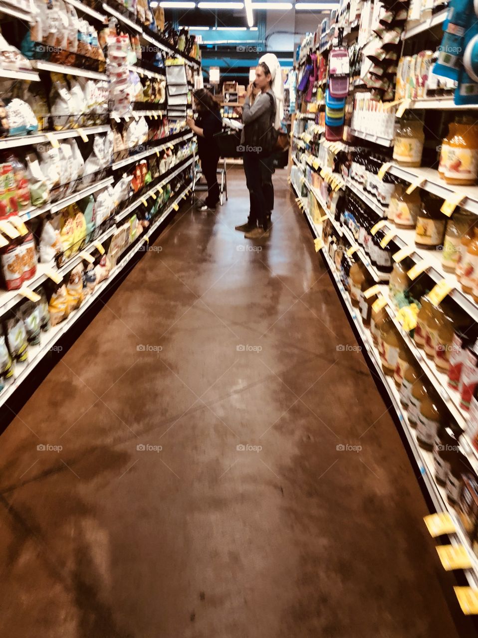 Busy woman at supermarket 