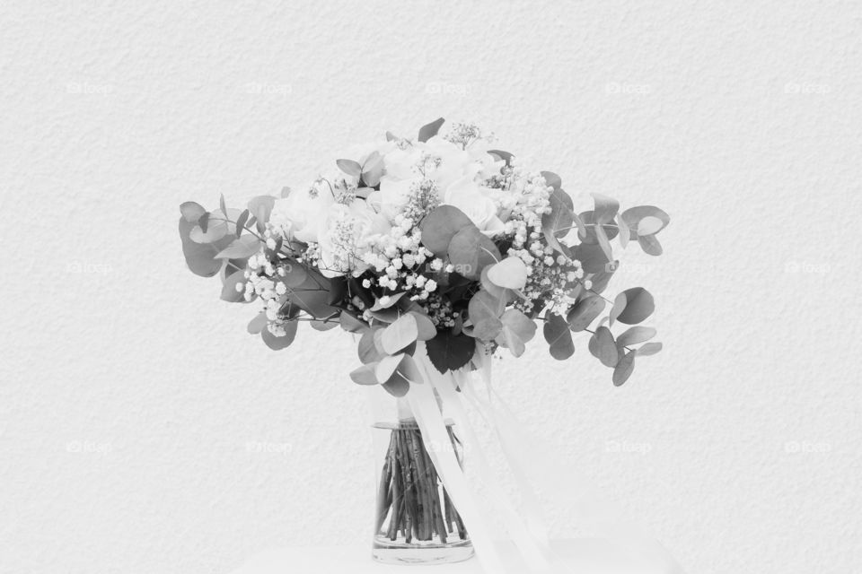 Beautiful wedding bouquet in a glass vase, black and white 