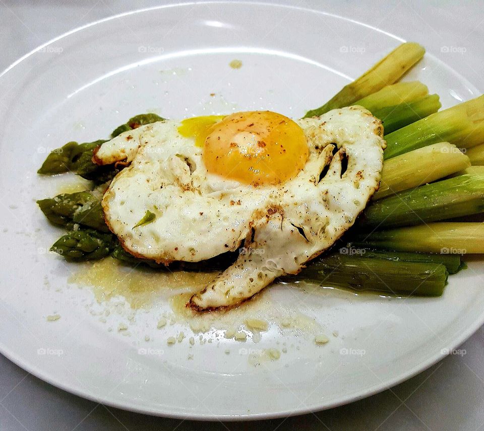 Asparagus and egg on plate