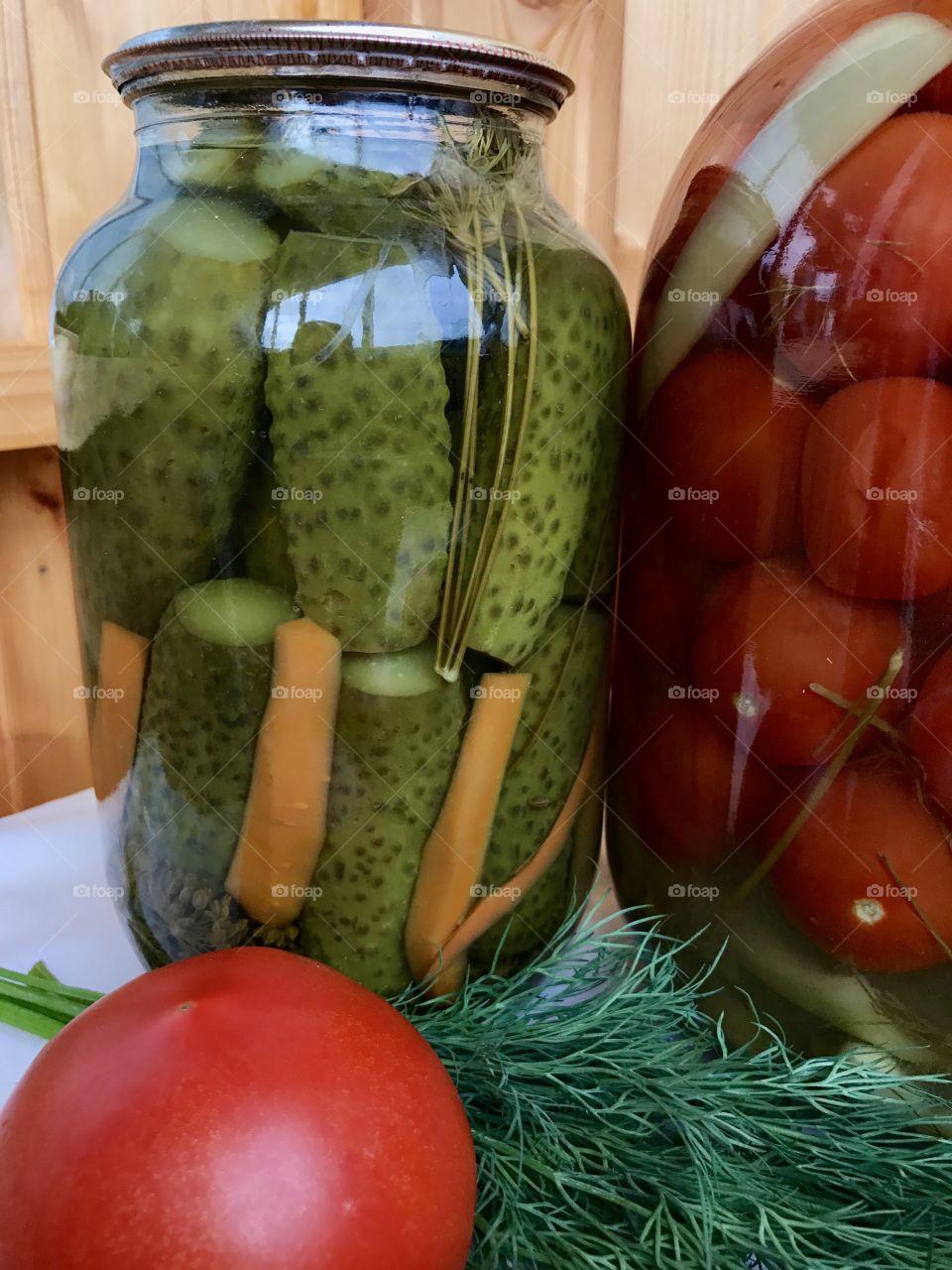 homemade pickles cucumbers and tomatoes 