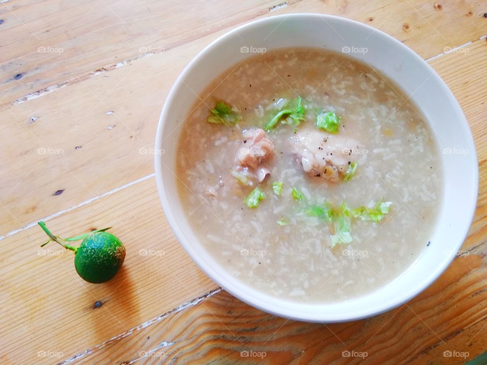 lugaw or chicken soup with rice and calamansi citrus fruit
