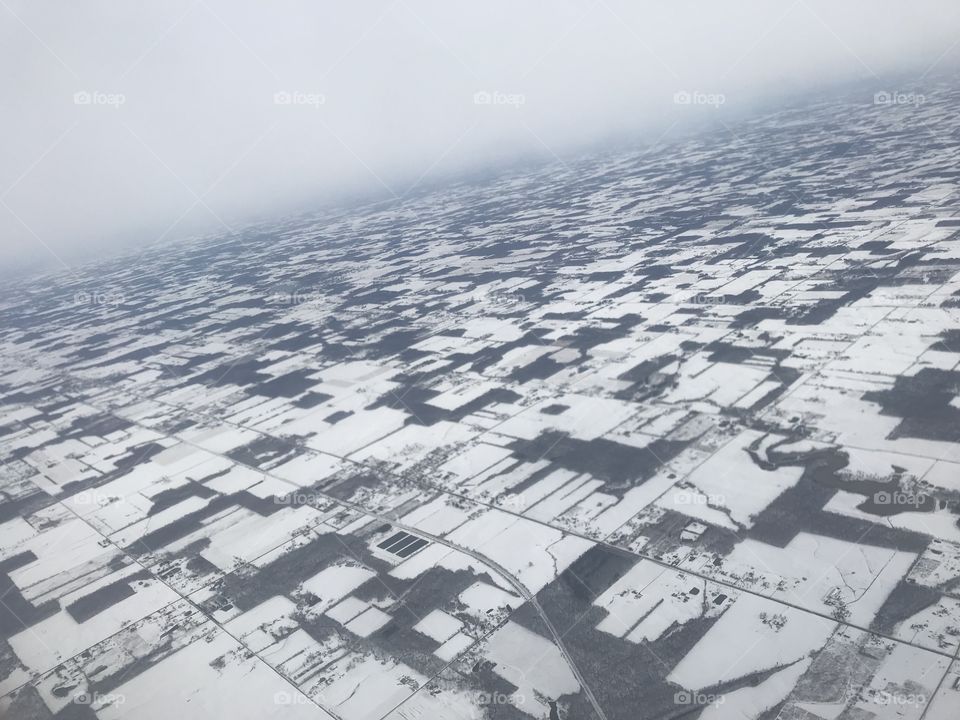 Aerial view of snow covered rural America 
