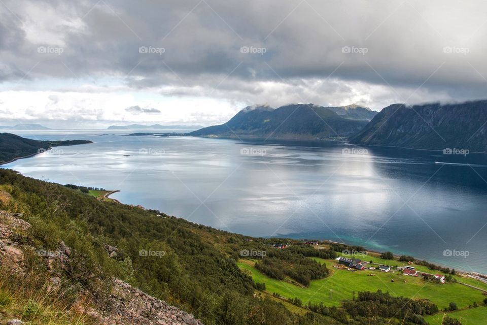 View of mountains with lake in Harstad, Norway