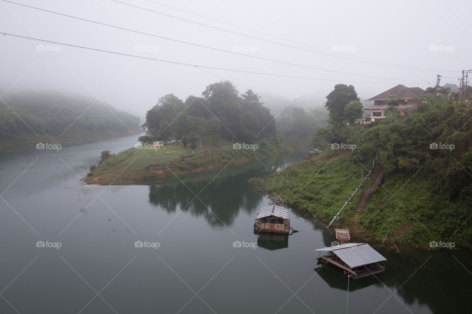 House in the river with mist