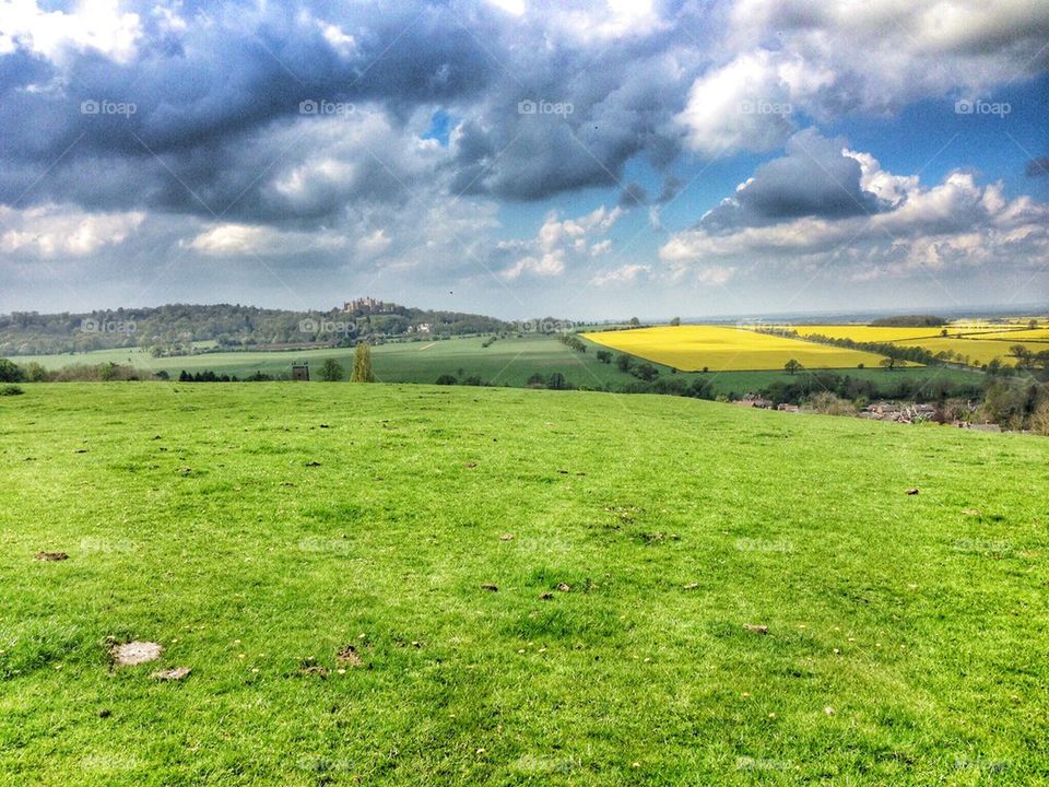 Grassy land against dramatic clouds
