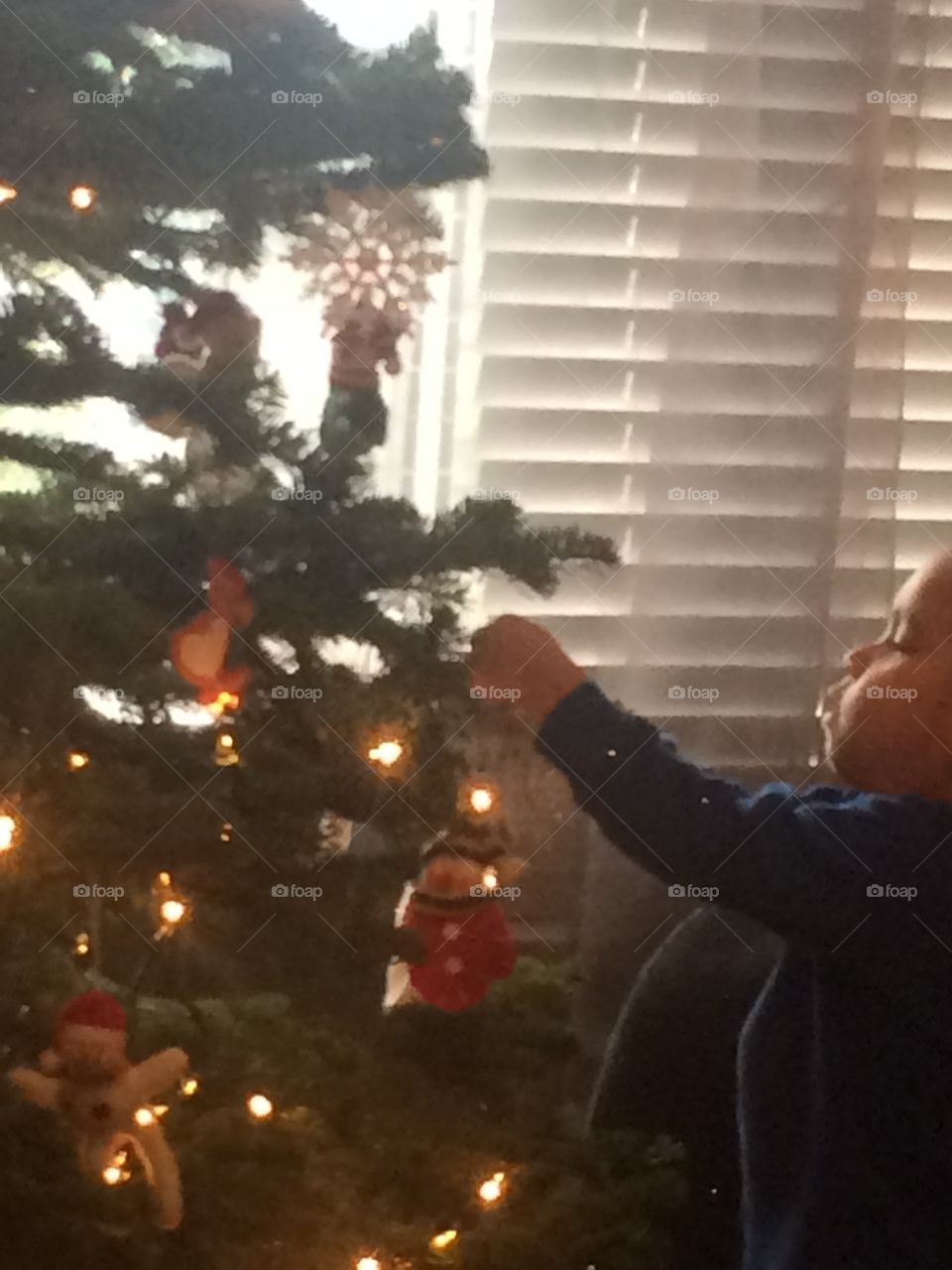 Child and Christmas tree