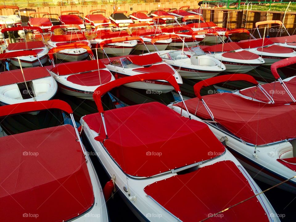 Small speedboat covered with a red tarpaulin