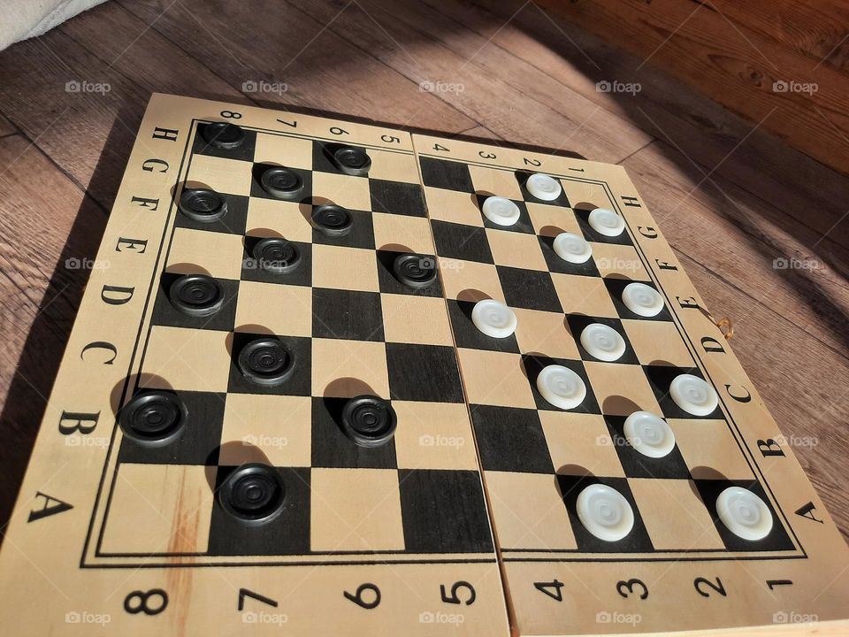 checkers, a board game based on thinking and strategy.