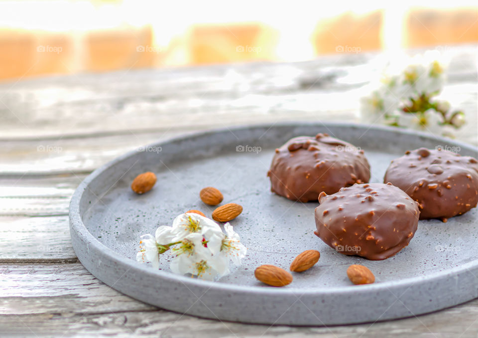 Traditional dessert Cake pops made by chocolate and almond flour on the wooden background.