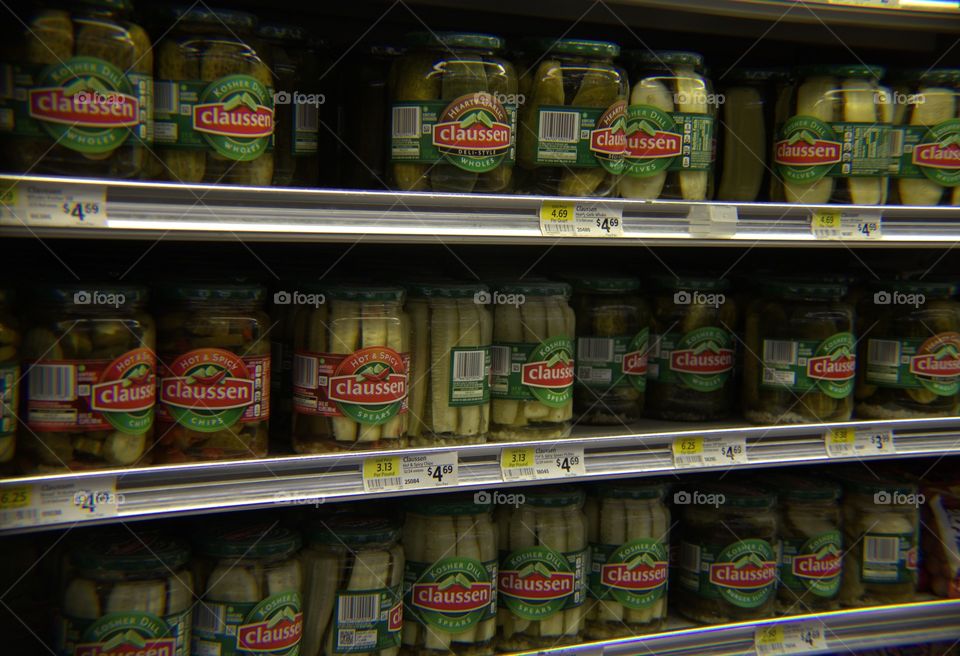Jars of Mixed Variety Pickles Stacked on Shelves