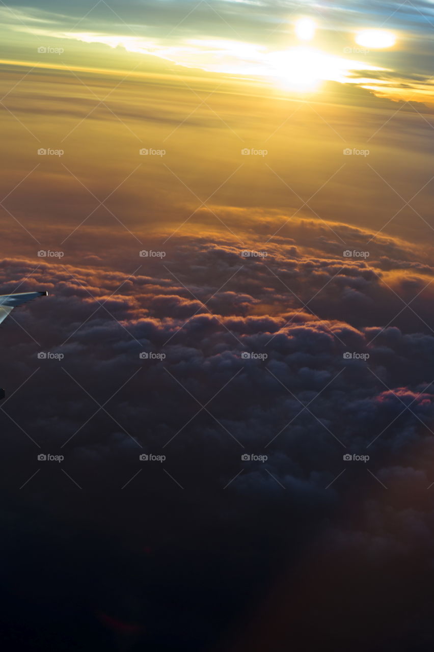 Amazing sunset sky view from the plane. looking out of the window to see the beauty the world offer