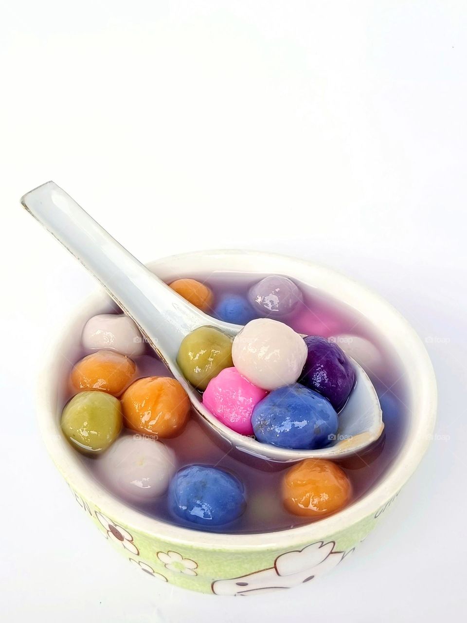 colourful glutinous rice balls on white background.