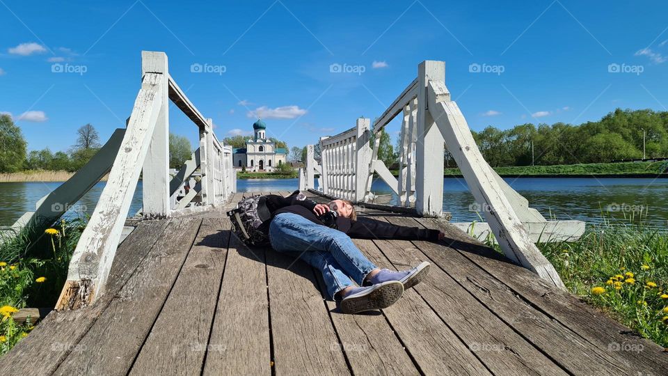 rest on the bridge over the lake in front of the church