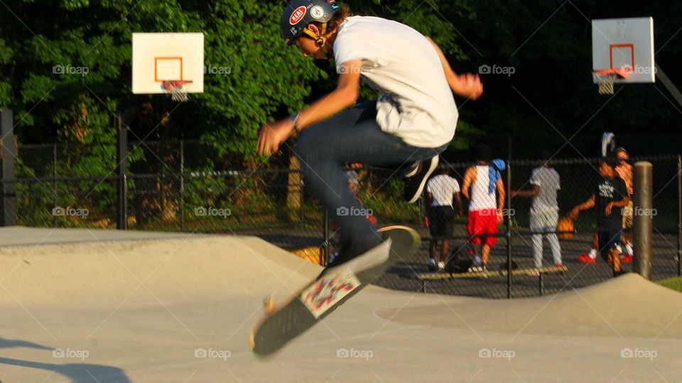 Skateboarder Airborne While Performing A Trick