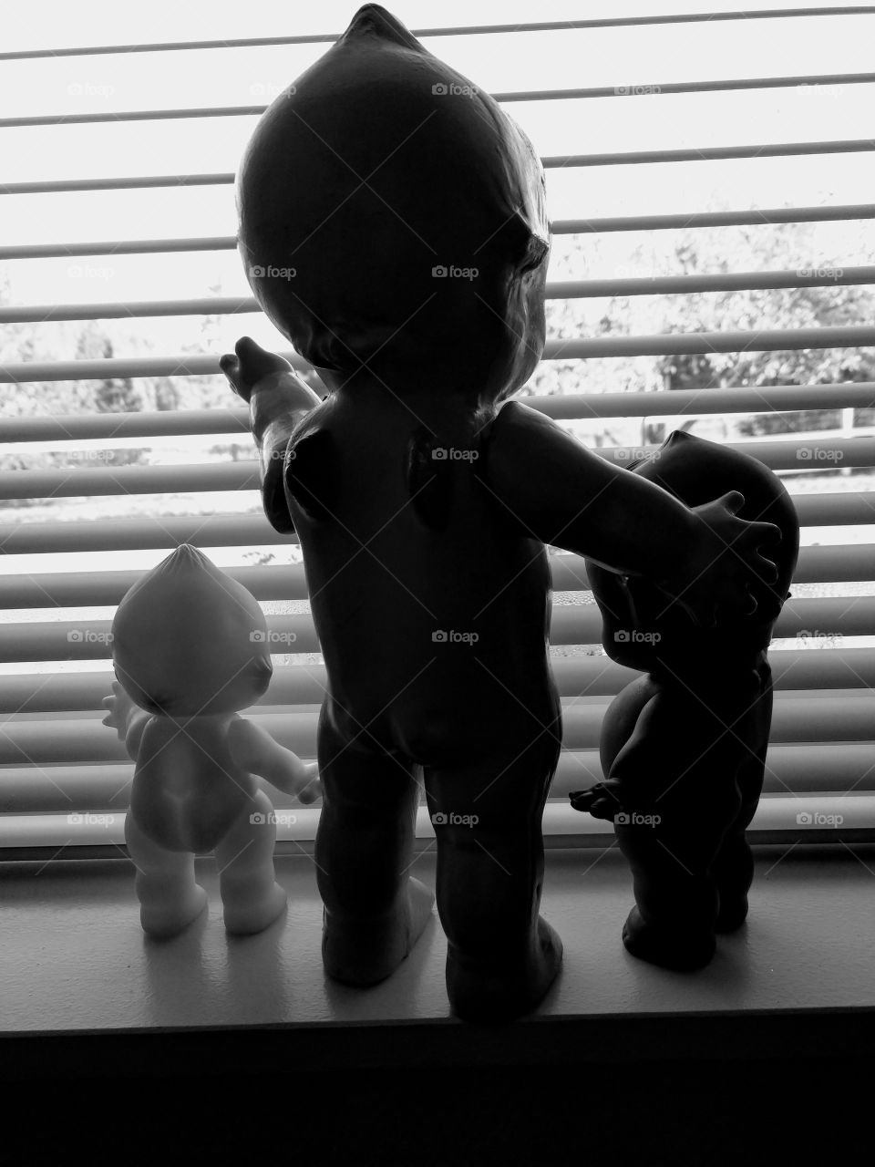 Kewpie doll family silhouette window