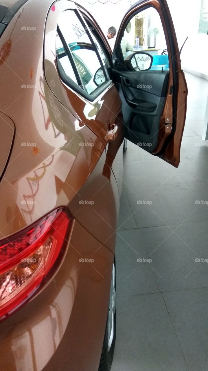 brown colourful cars in parking