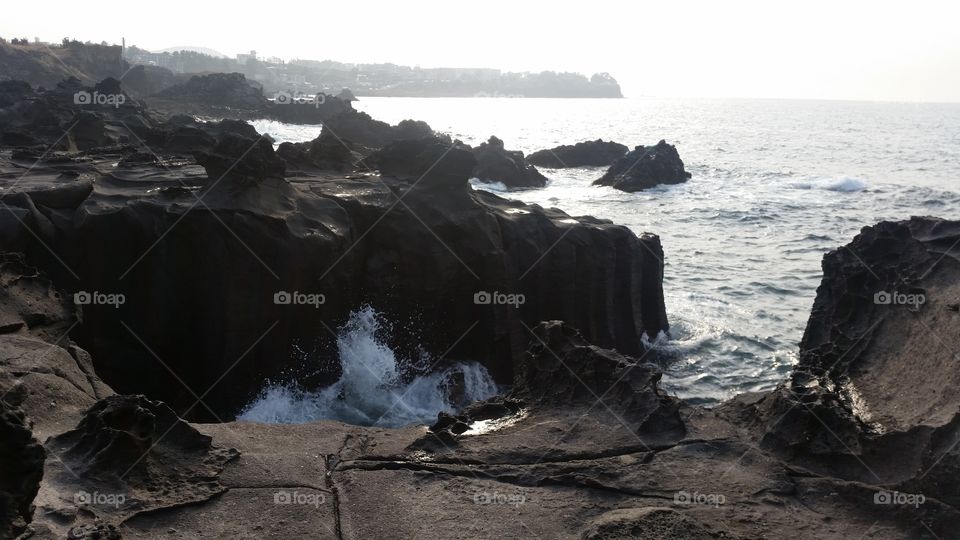 Pitch Black Lava Cliffs. 
Jeju Island, South Korea