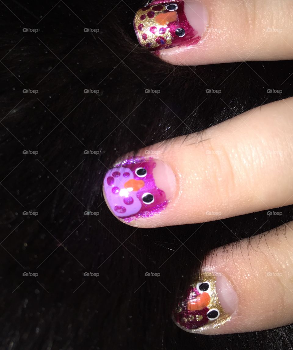 I decided to paint owls on my nails tonight. I love doing my own nail art. And they look so nice up against the shiny black fur of my cat!