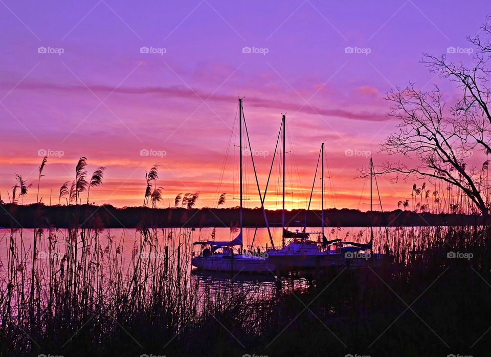 Magic Sunrise and Sunset - Mesmerizing sunset - Bright streaks of red, pink, and orange slowly overcame the dark blue and purple of the twilight sky. The sky resembled a prism; all the colors blended perfectly into each other