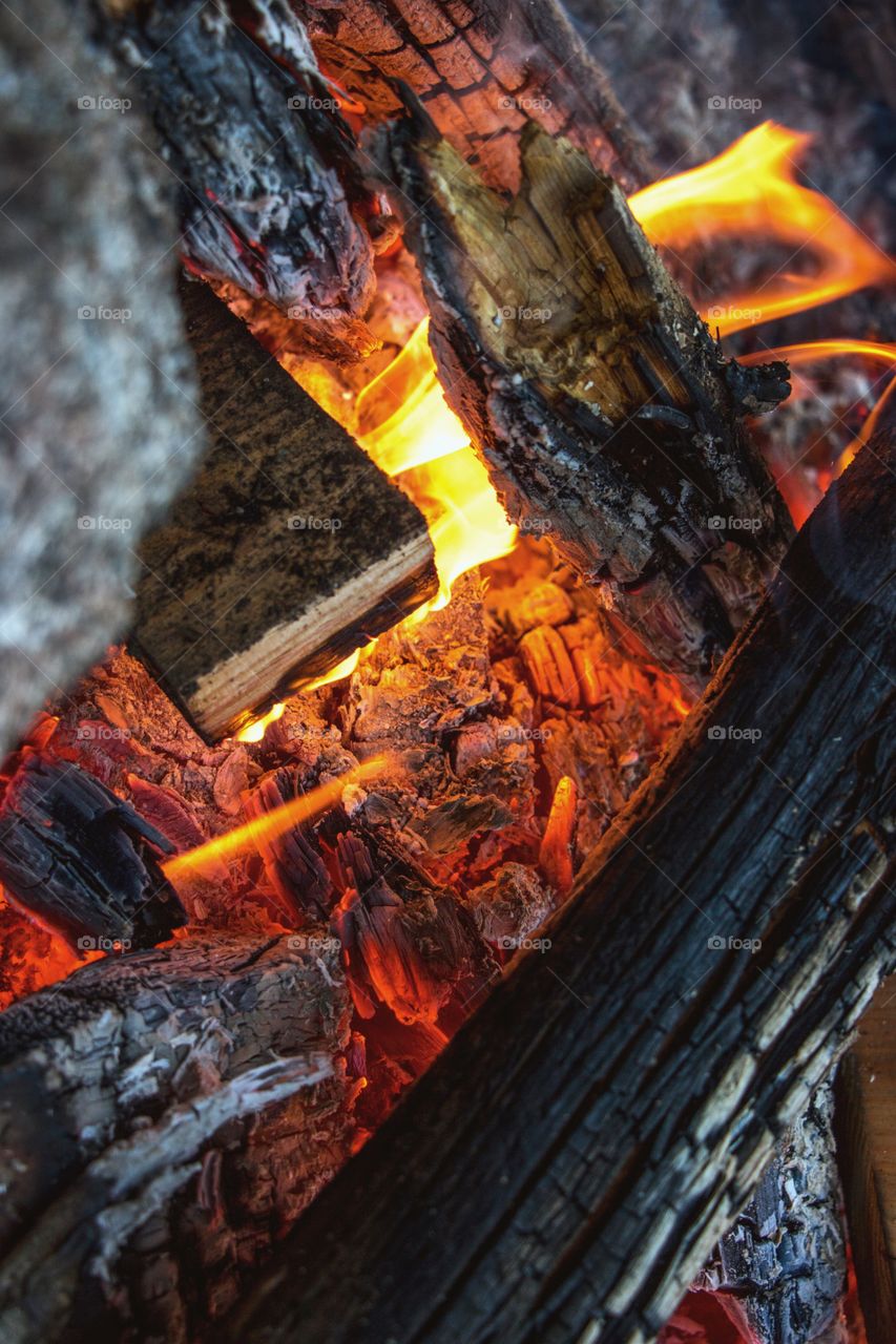 Burning embers in a beautiful, warm mountain bonfire. 