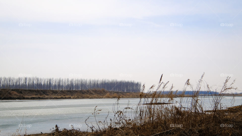 the ice on the river is melting