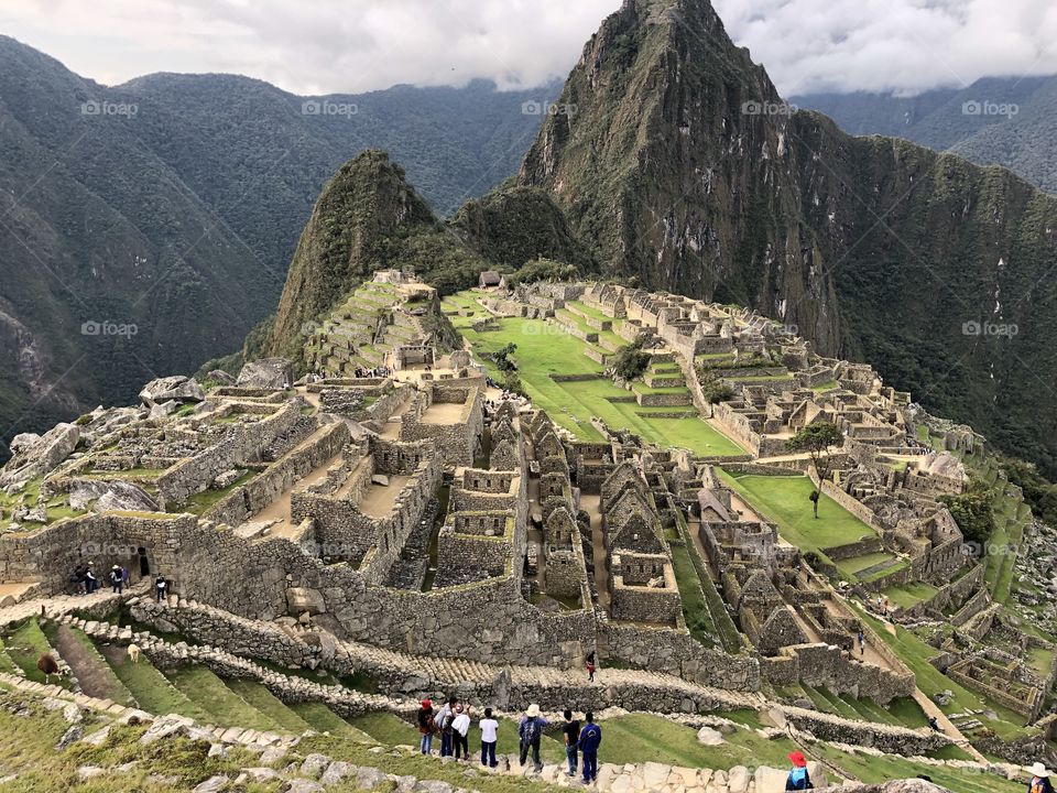 Side shot of Machu Picchu with tourists