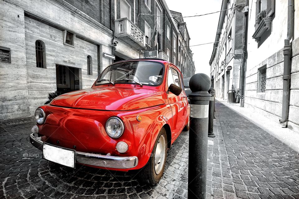 Fiat 500 red classic Italian car in Rimini Italy vintage colorsplash with black and white colors