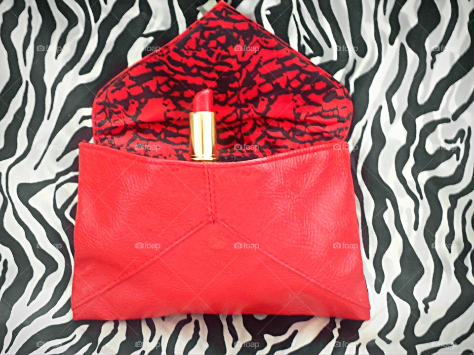 Red lipstick in red bag 