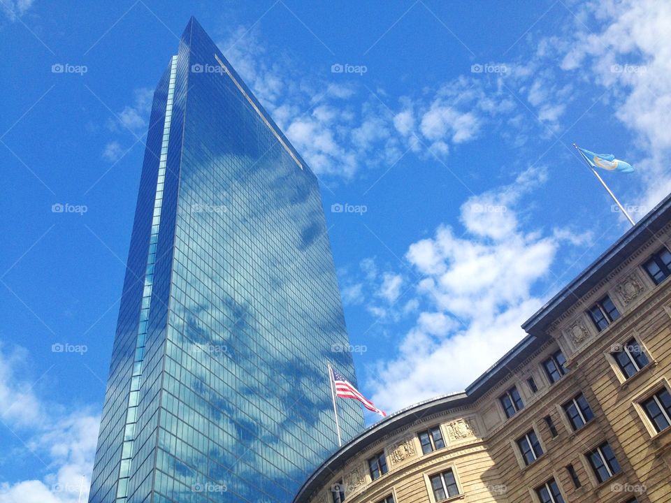 john hancock tower,Boston. John hancock tower near an ancient building in Boston