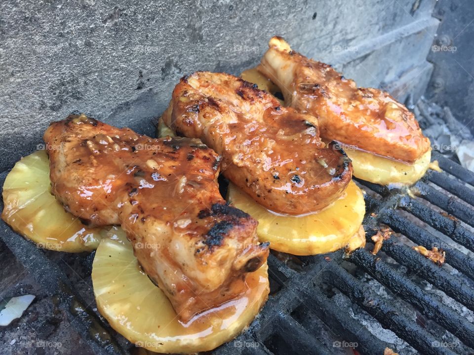 Grillin . Pork ribs over pineapples grilled 