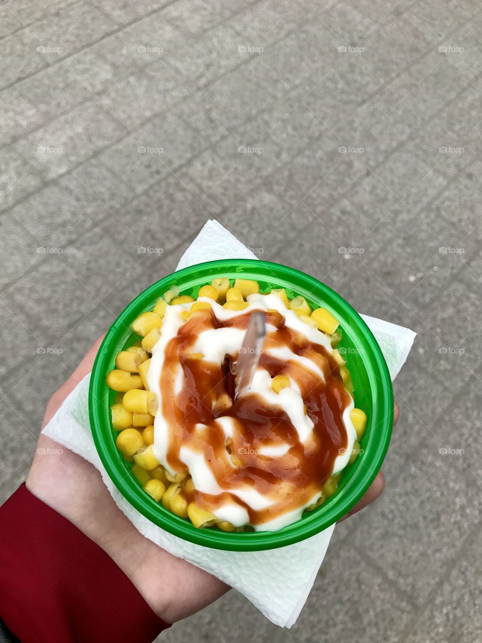 Corn with mayo and ketchup.