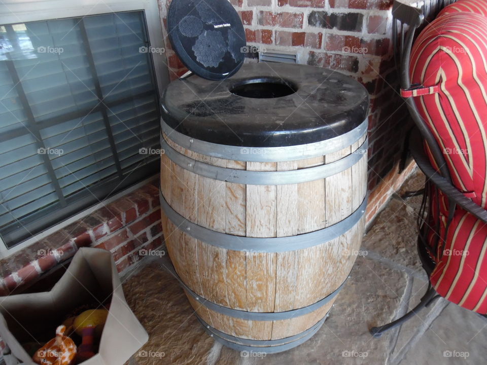 Whiskey barrel trash can